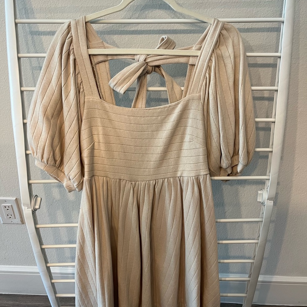 Tan short baby doll dress with bow.